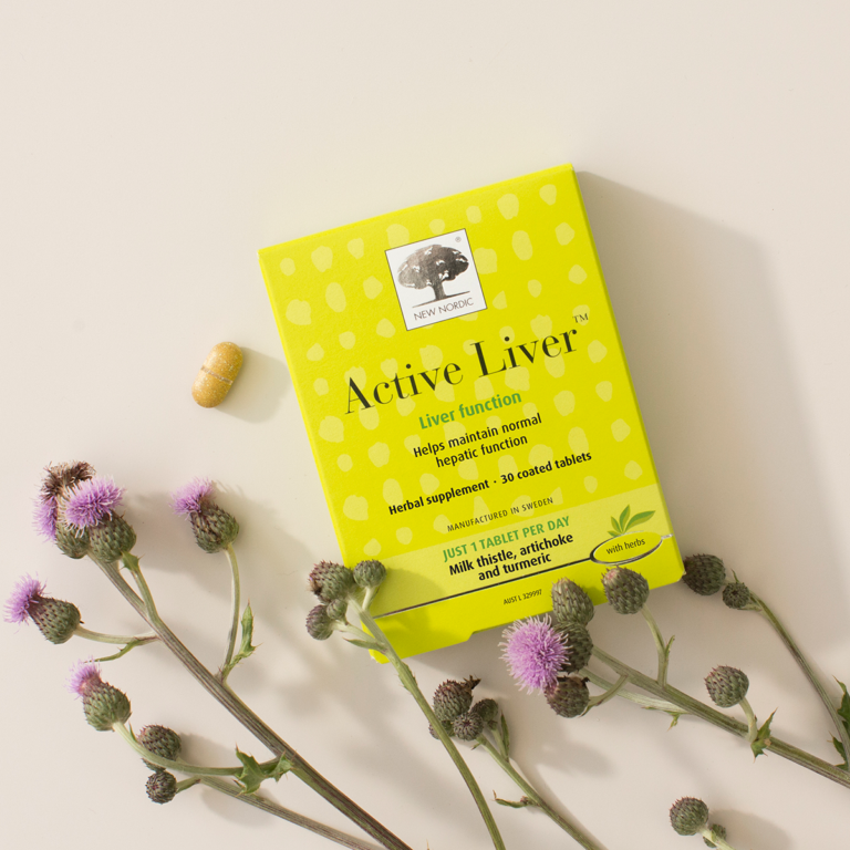 The yellow Active Liver package displayed with a tablet and milk thistle flowers.