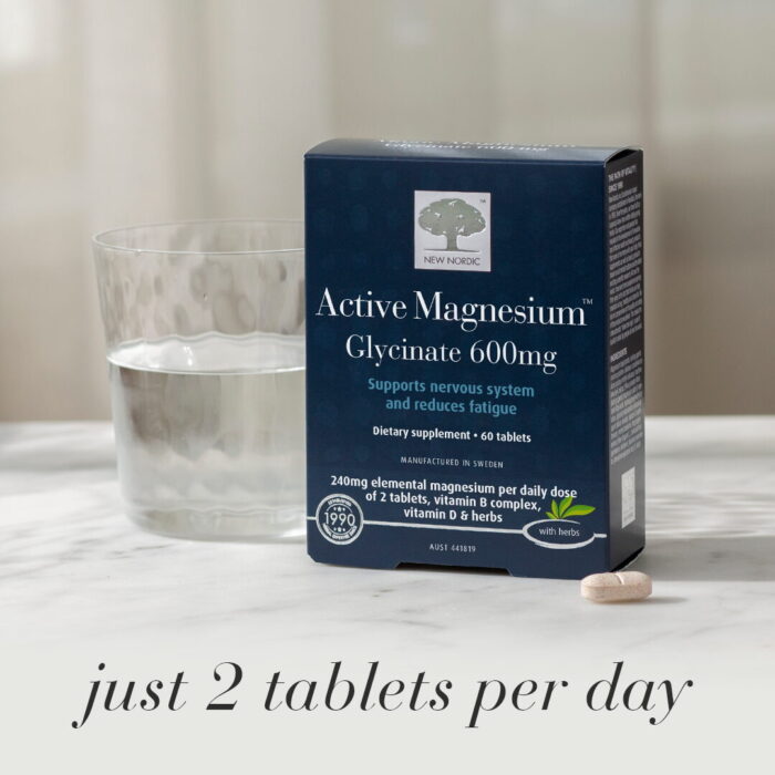 New Nordic Active Magnesium™ Glycinate 600 mg with a glass of water and tablet, with the text “just 2 tablets per day”.