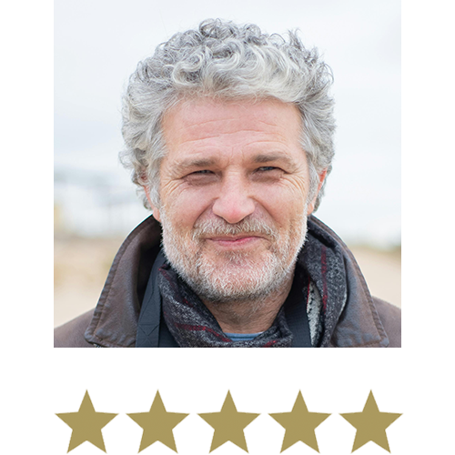 Man smiling with five stars beneath