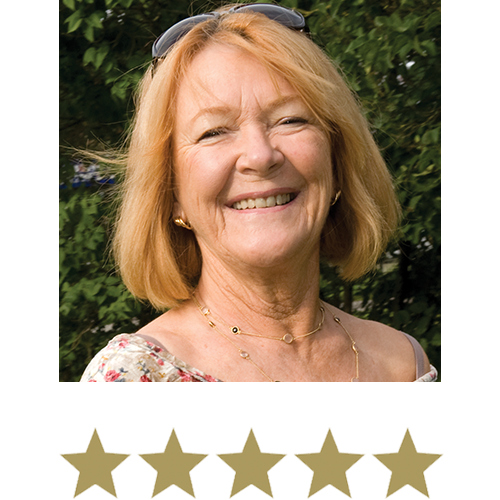 Woman smiling in nature with five stars beneath