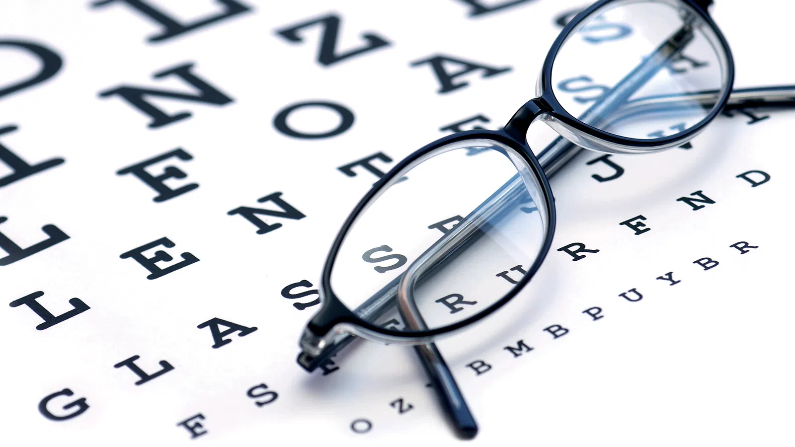 Blue Berry™ Eyebright Tablets 17 Eyeglasses on eye chart background.