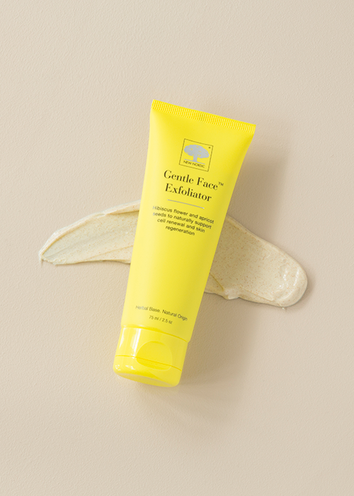 The yellow Gentle Face™ Exfoliator tube on a light background.